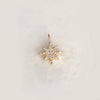 Solid Gold Starburst Cut Out Charm With CZ