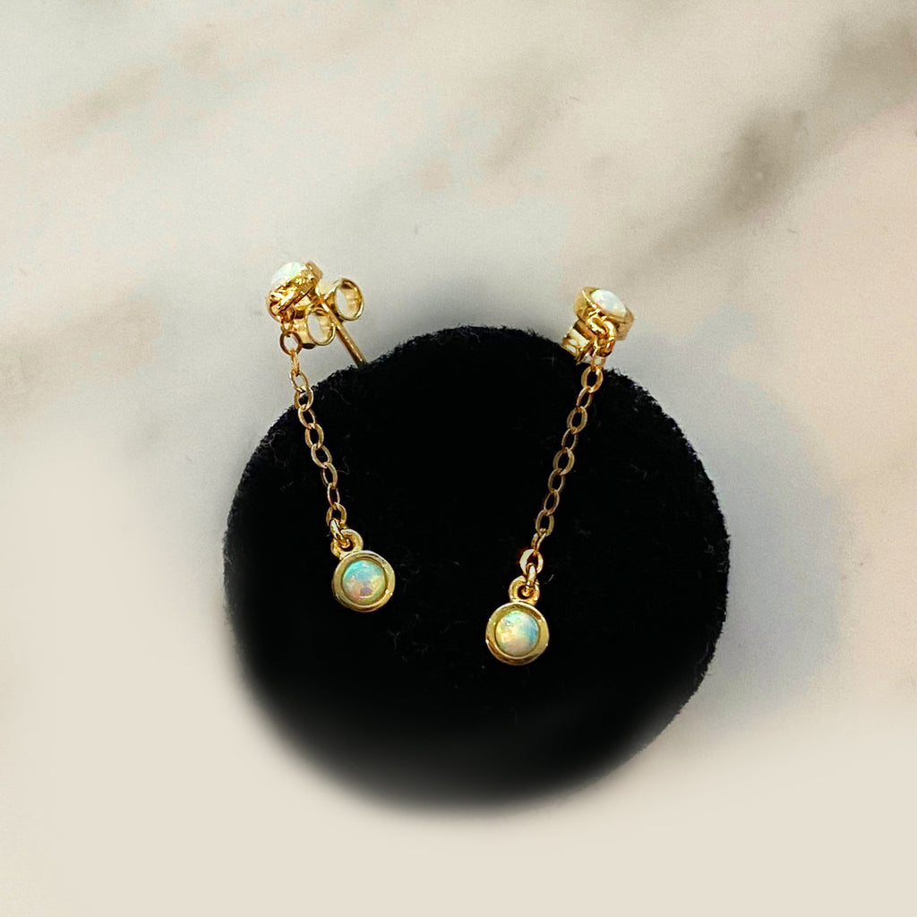 opal dangle earrings in sold gold